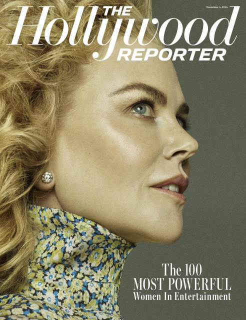 Close-up portrait of Nicole Kidman on The Hollywood Reporter cover, wearing a floral top and diamond earrings against a gray background.