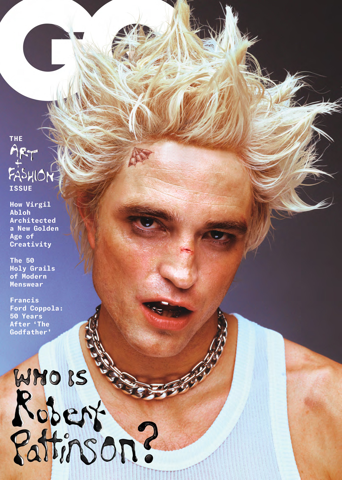 Magazine cover featuring Robert Pattinson with bleach blonde hair, wearing a chain necklace and a white tank top, close-up shot.