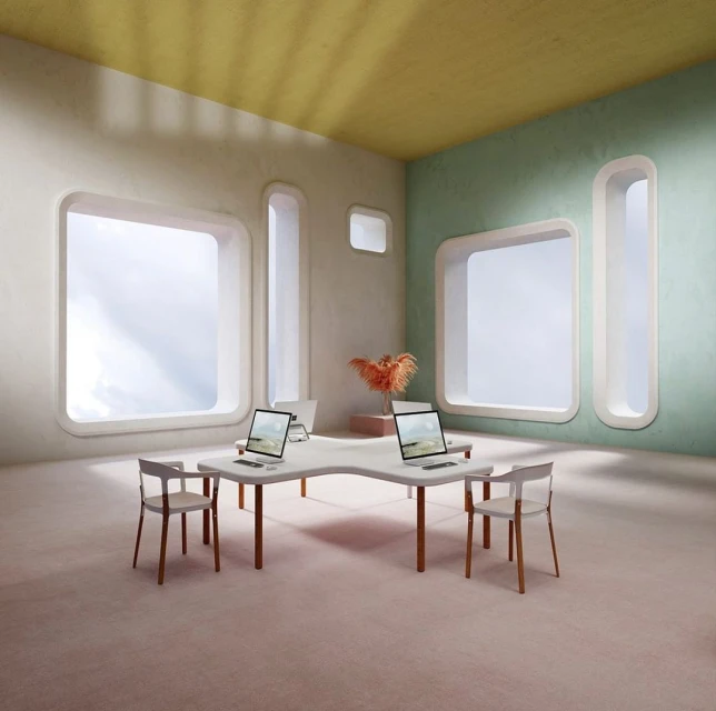 Minimalist office space with pastel walls, large windows, and laptops on a shared desk, chairs around it, and an orange plant.