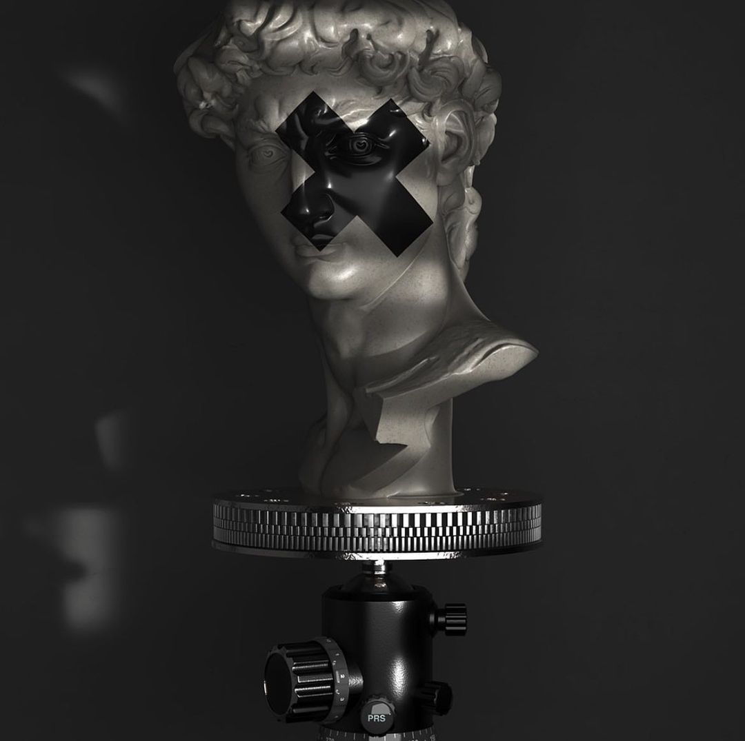 Bust sculpture on a tripod with black tape 'X' across the eyes, shot in a low-key style against a dark backdrop with faint lighting.
