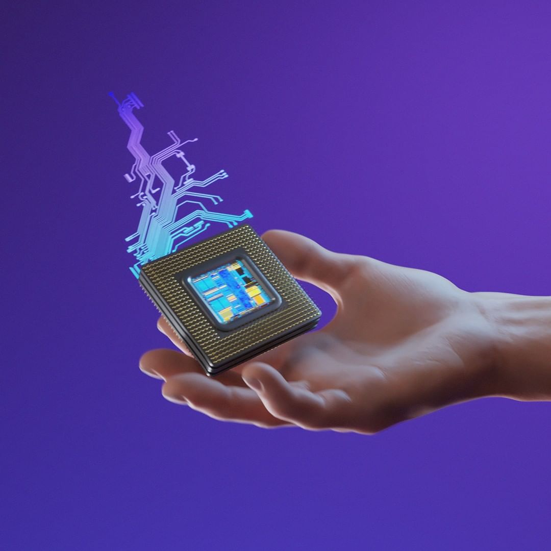 A hand holds a computer chip with electronic circuit-like designs on a purple background, showcasing technology and innovation.