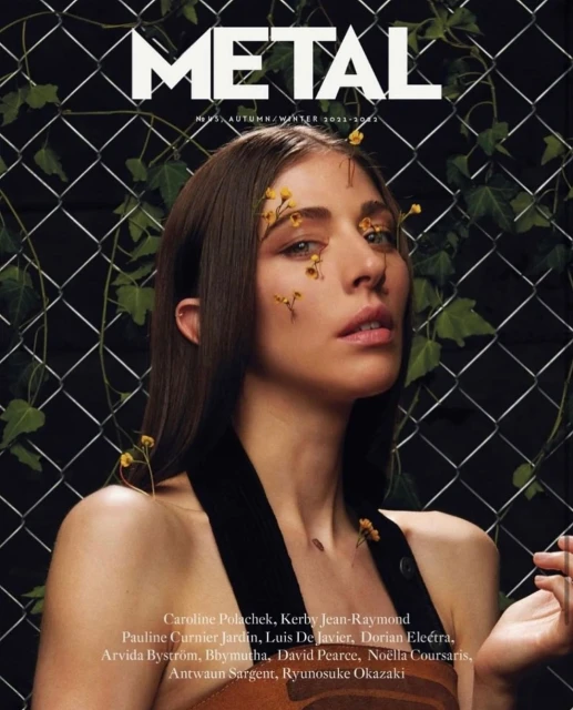 Metal Magazine cover featuring an adult female model with flowers, posing against a chain-link fence with ivy.