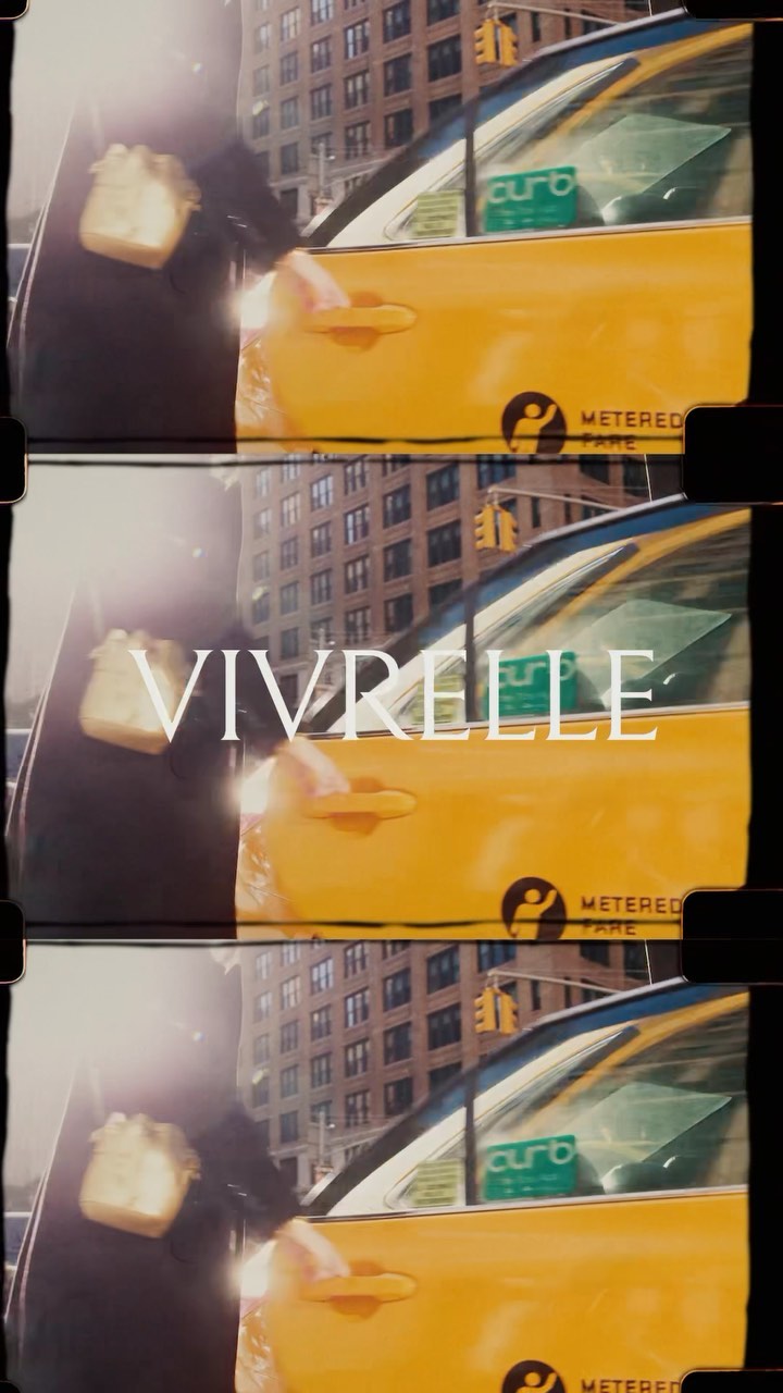 Yellow taxi in urban setting with woman partially visible. Building in background, and large text overlayed on image.