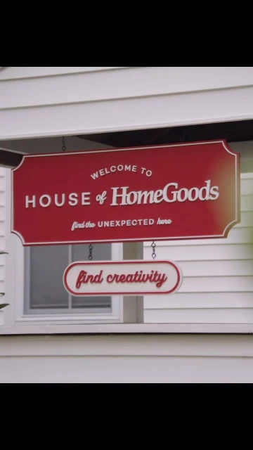 Sign for House of HomeGoods store featuring the words 'find creativity' below the main sign on a white building exterior.
