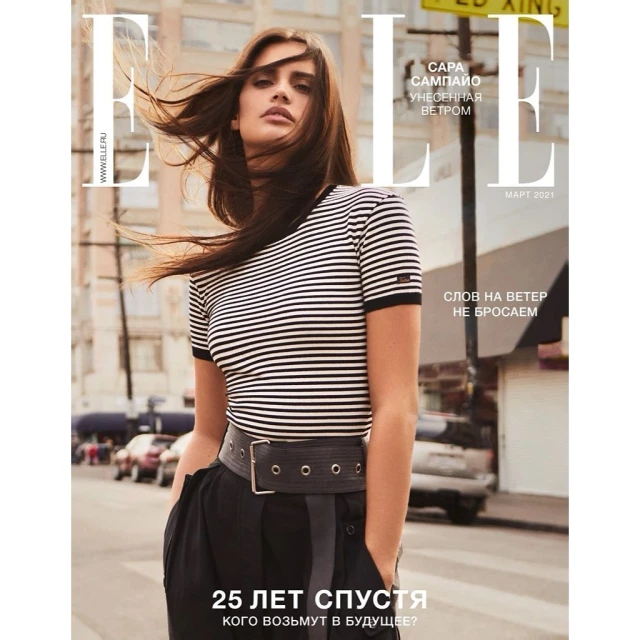 Elle magazine cover featuring Sara Sampaio wearing a striped top and dark pants on an urban street with an out-of-focus background.