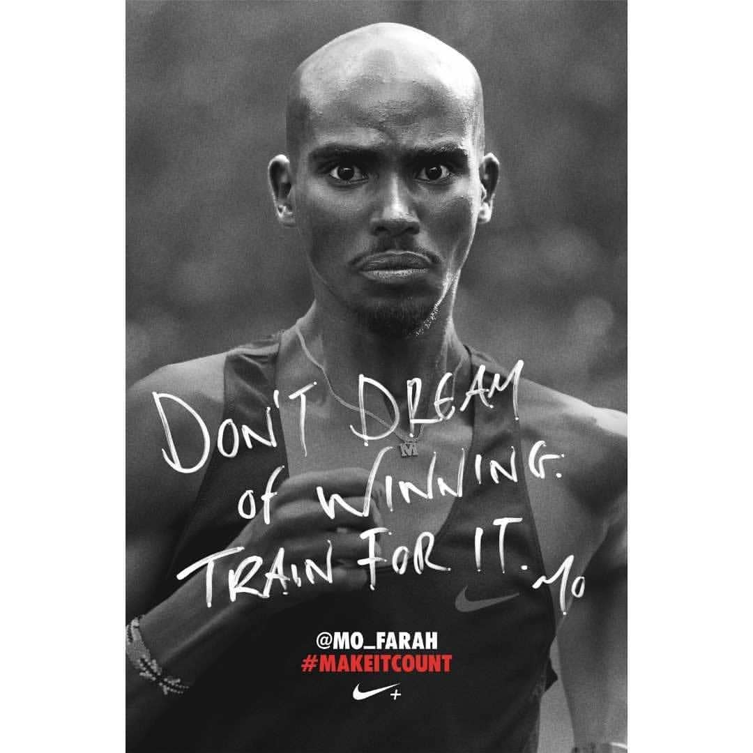 Black and white portrait of Mo Farah, a male athlete, looking at the camera with motivational text and Nike logo in soft focus.
