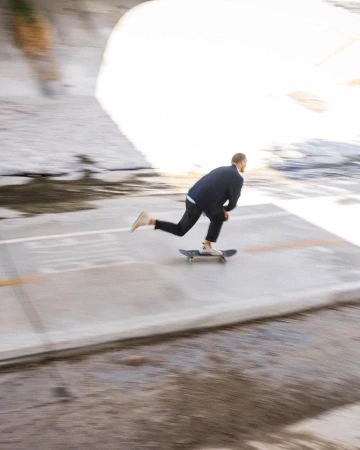 Man skateboarding down a concrete slope in Los Angeles with motion blur captured by photographer Adam Moran