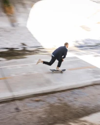 Man skateboarding down a concrete slope in Los Angeles with motion blur captured by photographer Adam Moran
