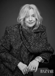 Portrait of an older woman with blonde hair wearing a patterned tweed coat and stacked bracelets by photographer Michele Aboud