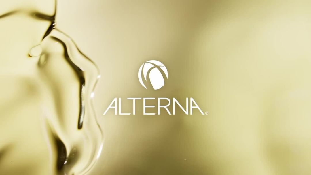 Alterna brand logo displayed with liquid, highlighting the beauty and hair care industry aesthetic and product quality.