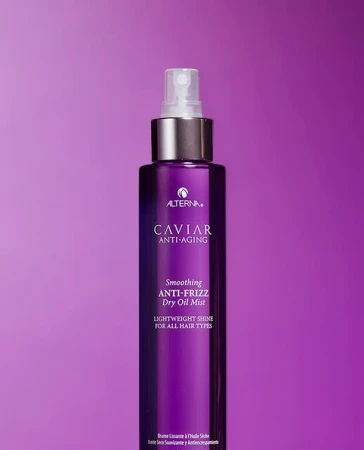 Alterna Caviar Anti-Aging Smoothing Anti-Frizz Dry Oil Mist. Purple bottle with silver accents set against a purple background.
