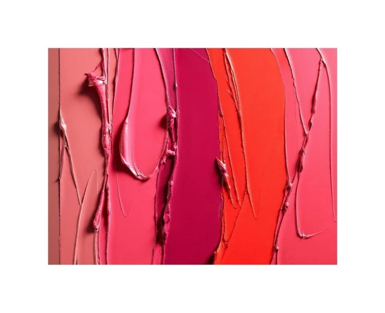 Abstract close-up of cosmetic product swatches with red, pink, and orange creamy textures, and a vertical composition on a white background.