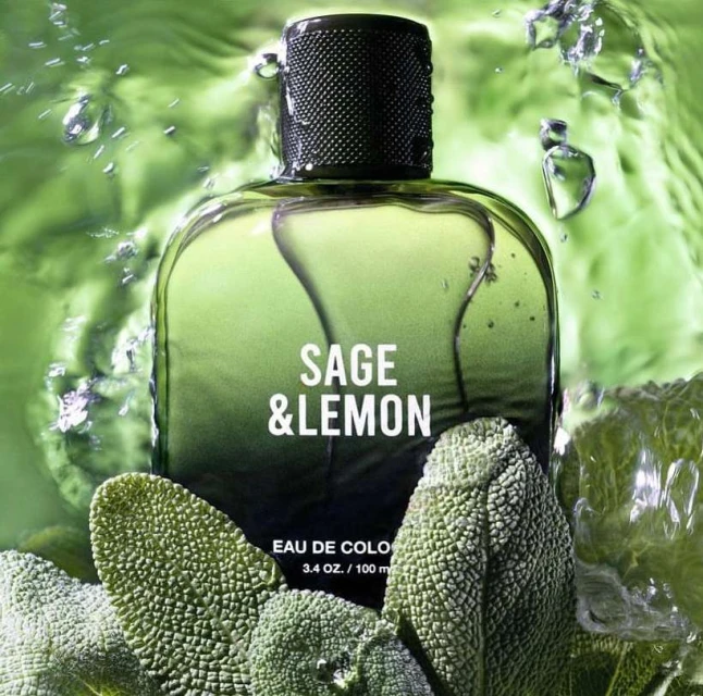 Fragrance bottle of Sage & Lemon Eau de Cologne with water droplets and sage leaves, against a green background.