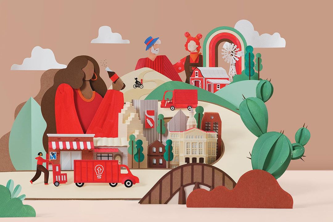 Paper art illustration featuring people, buildings, delivery trucks, and a whimsical landscape, creating a vibrant, multi-layered community scene.