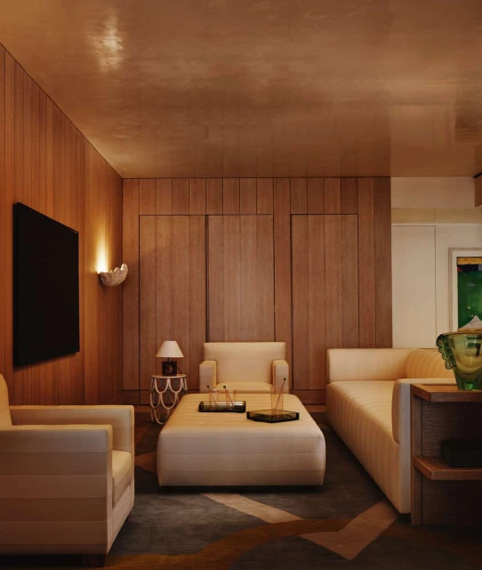Interior design showcasing a living room with neutral-toned furniture, including a sofa, armchairs, ottoman, and wood-paneled walls.