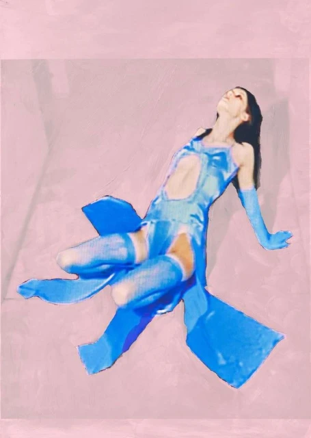 A slender woman with dark hair reclines on a pink surface, wearing a cutout blue dress and gloves, creating an artistic and surreal aesthetic.