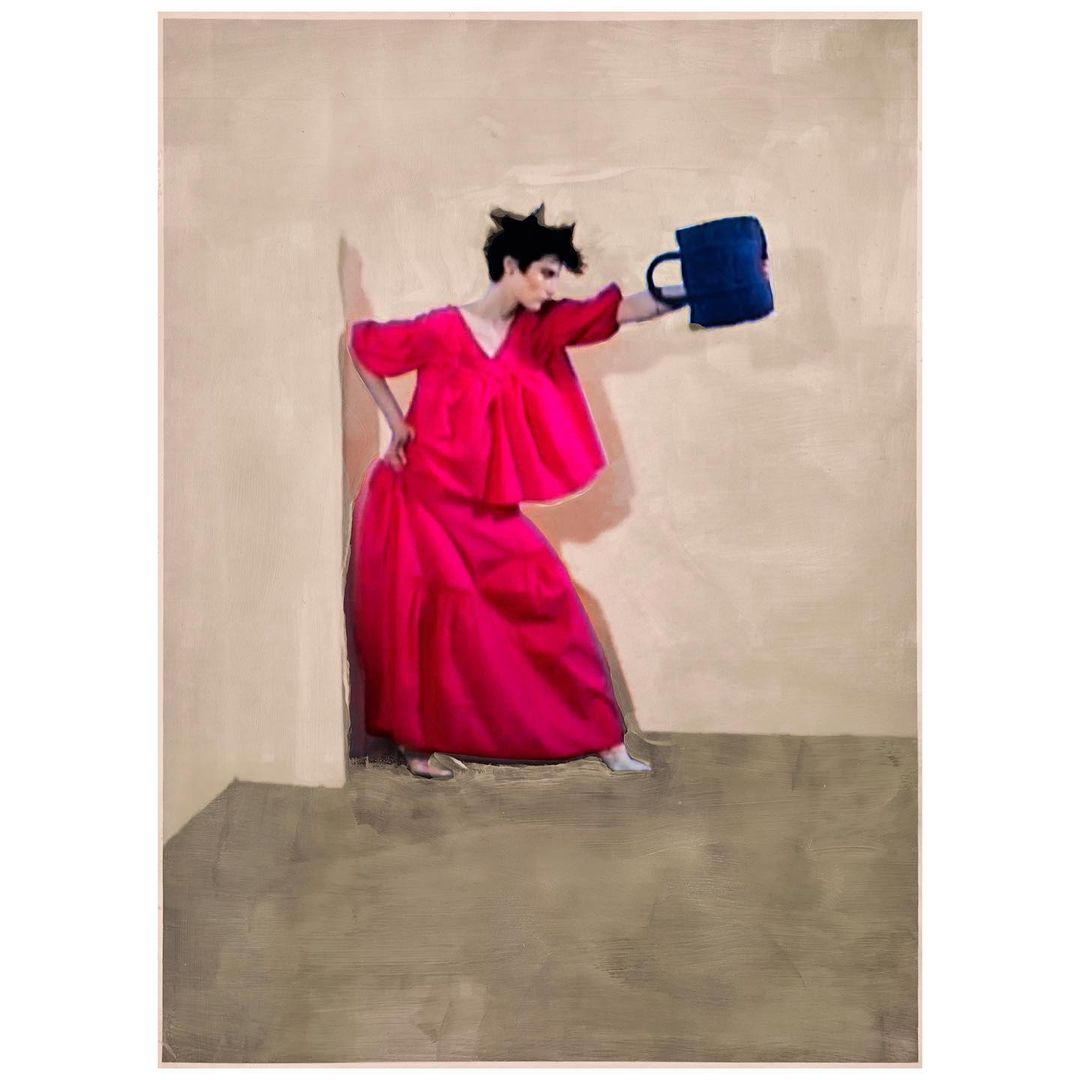 A person poses in a room wearing a pink dress, holding a blue object. The shot captures a fashion-forward art direction with neutral walls.