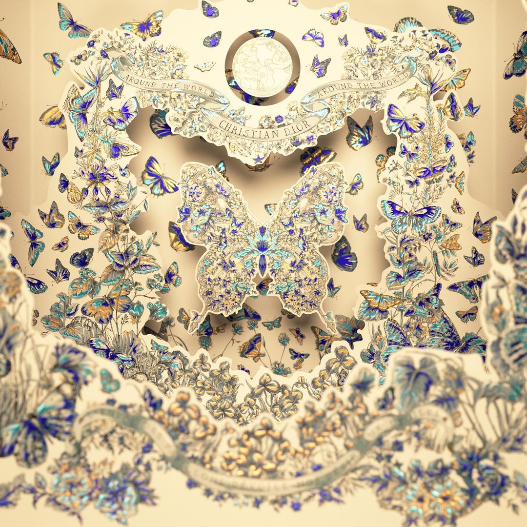 Elaborate paper art installation featuring numerous butterflies and floral designs in a decorative, multi-layered composition.