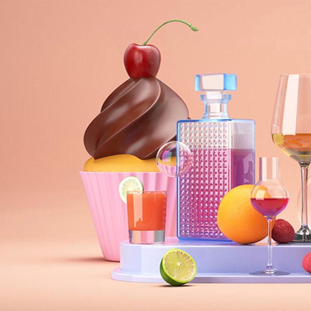 Stylized composition with a cherry-topped cupcake, designer perfume bottle, wine glasses, various citrus fruits, and a pink gradient background.