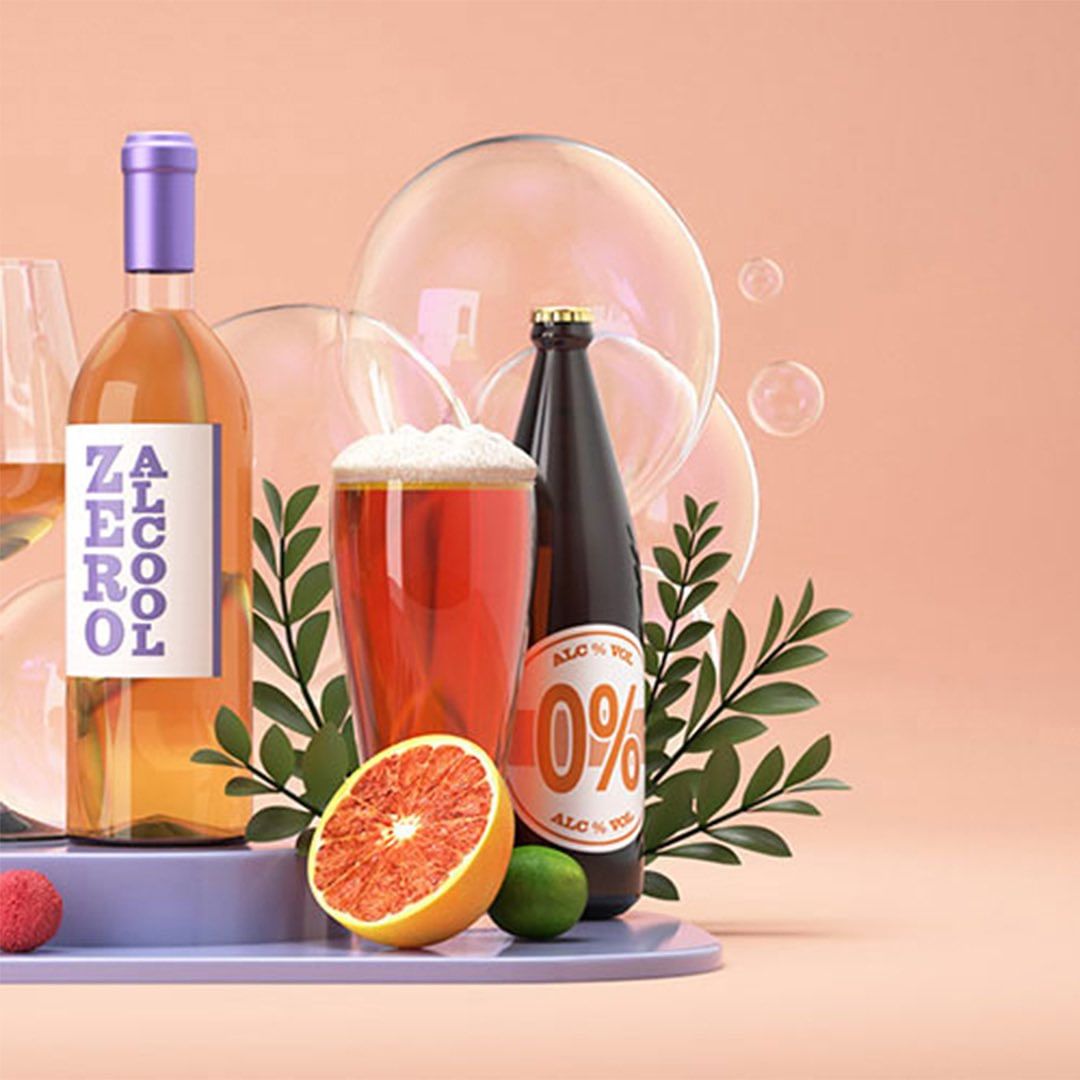 Still life of non-alcoholic drinks: wine bottle, beer bottle, beer glass, citrus fruit on platform, peach background with bubbles, leaves.
