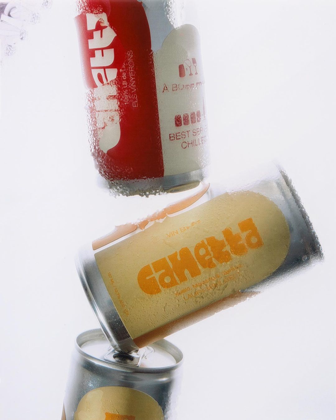 Three aluminum cans of Gametta soda stacked against a white background, showing condensation droplets and the vintage branding.