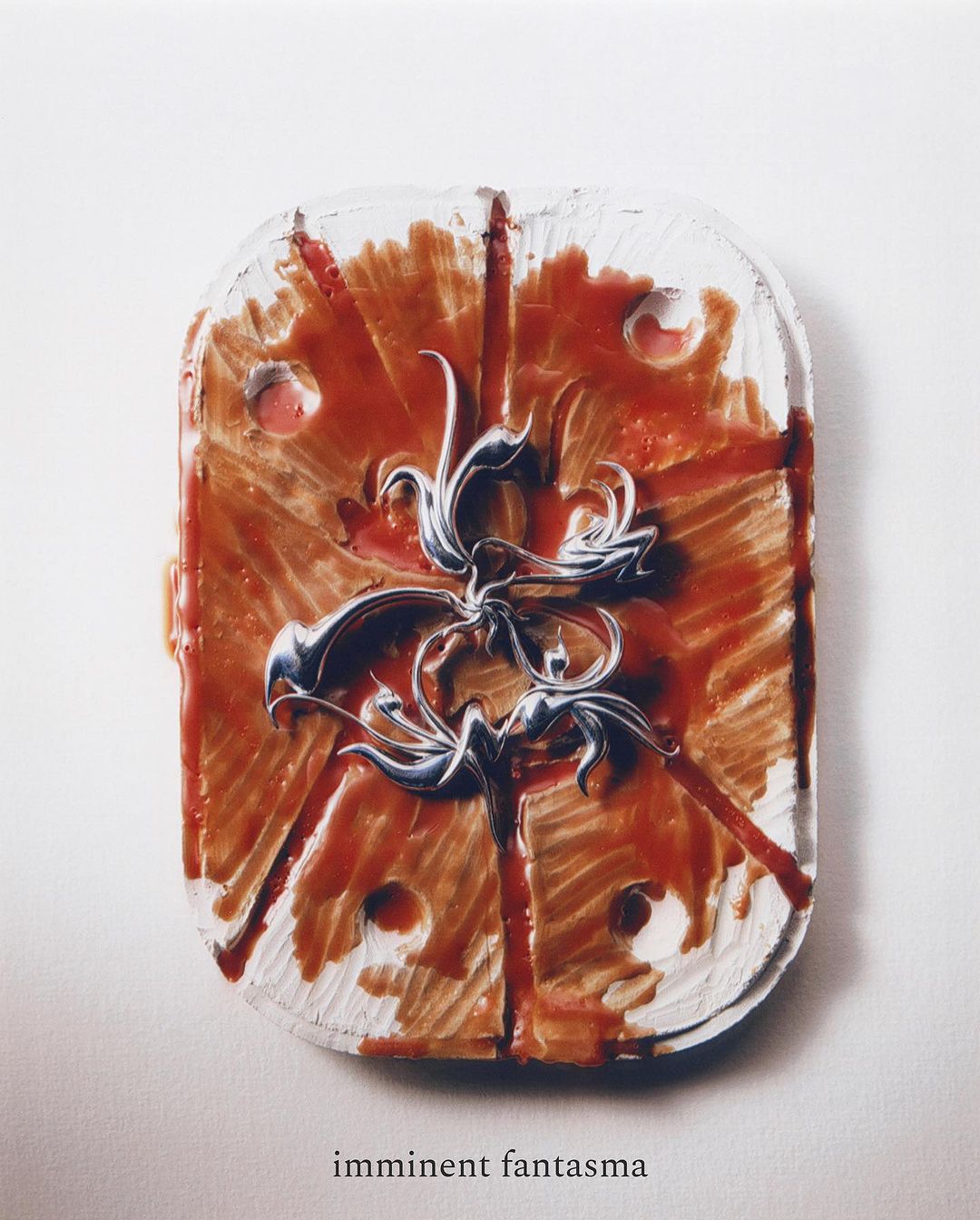 Abstract textured mixed media art featuring a red and brown color scheme with white accents, a decorative emblem, and a glossy finish.
