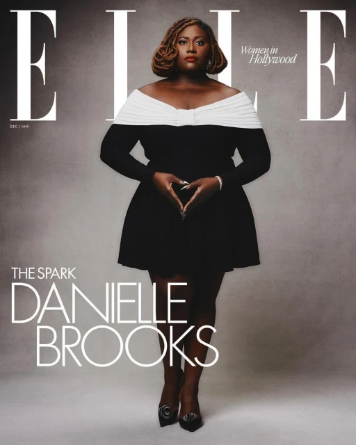 Danielle Brooks on the cover of ELLE Women in Hollywood issue, wearing a black and white dress, making a heart shape with her hands.
