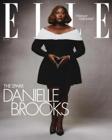 Danielle Brooks on the cover of ELLE Women in Hollywood issue, wearing a black and white dress, making a heart shape with her hands.