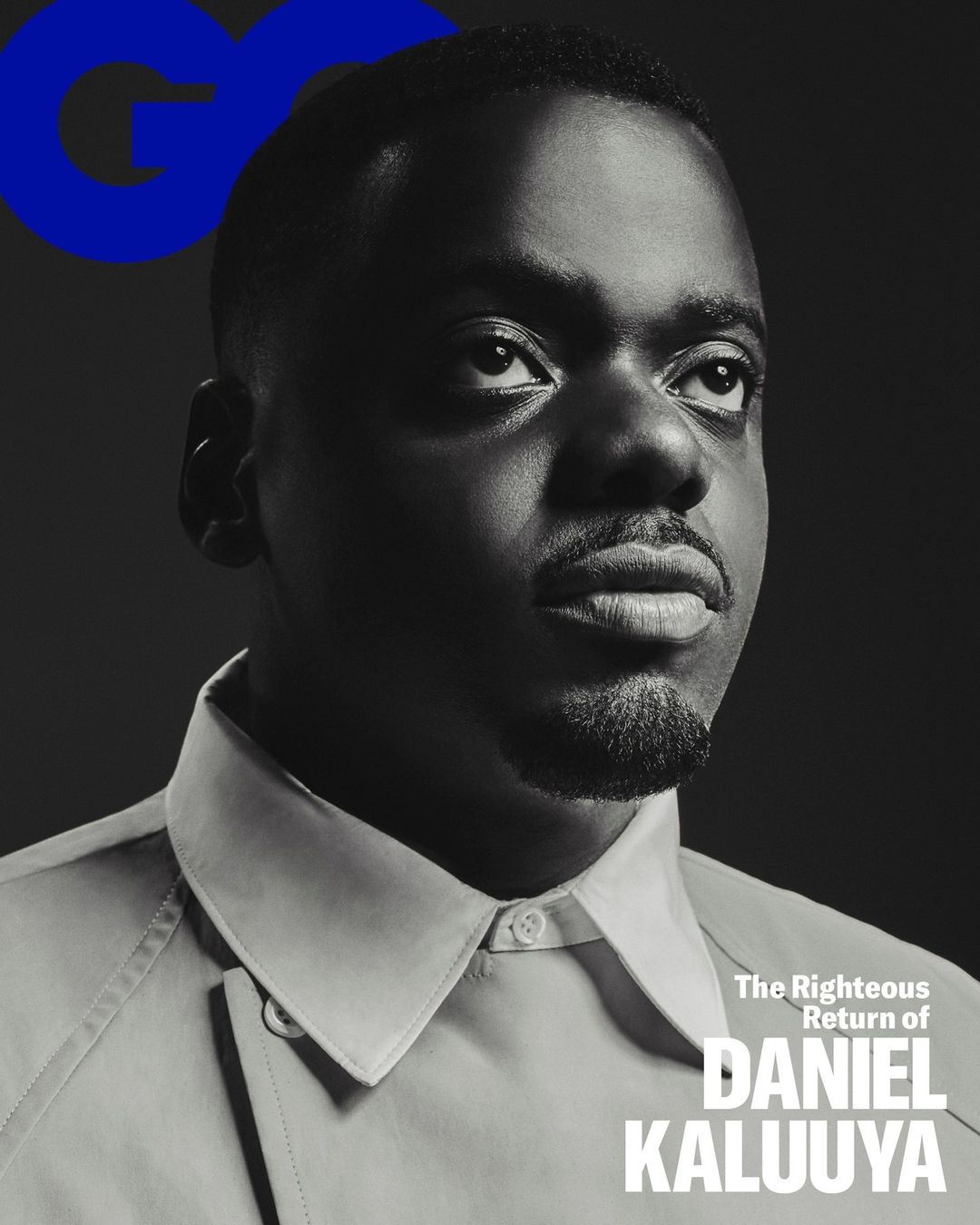 Close-up black and white portrait of Daniel Kaluuya on GQ magazine cover. The actor is looking up with a collared shirt, against a dark backdrop.