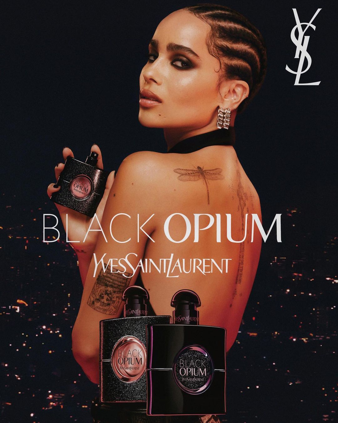 Beauty ad for Yves Saint Laurent Black Opium perfume features a woman with braided hair, bare shoulders, and perfume bottles in foreground.