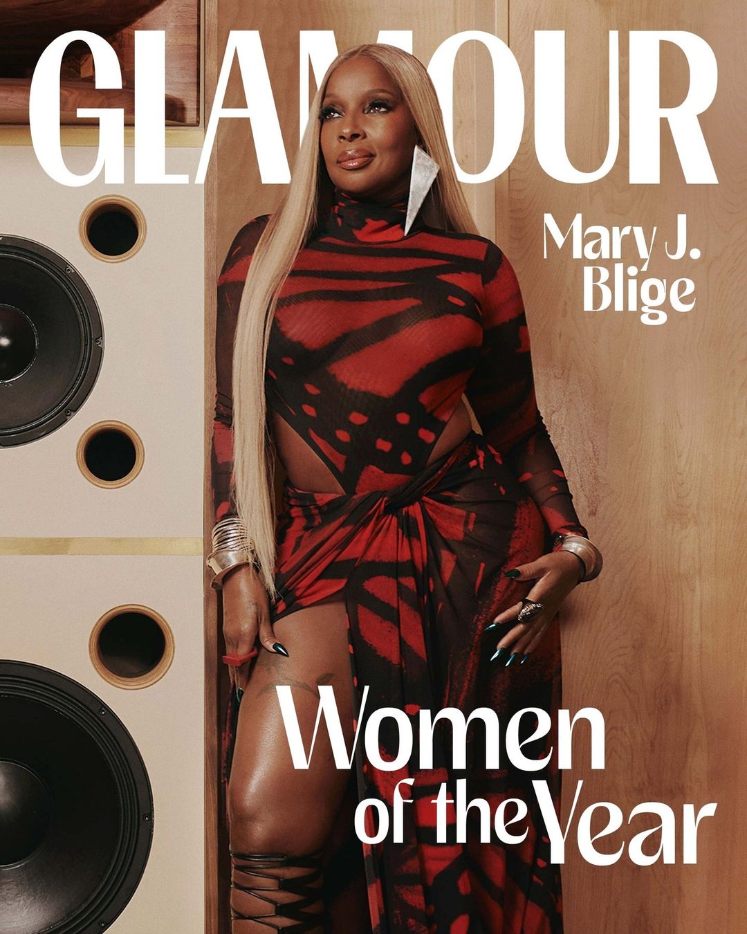 Glamour cover featuring Mary J. Blige in a red and black print dress with blonde hair, standing next to a speaker cabinet.