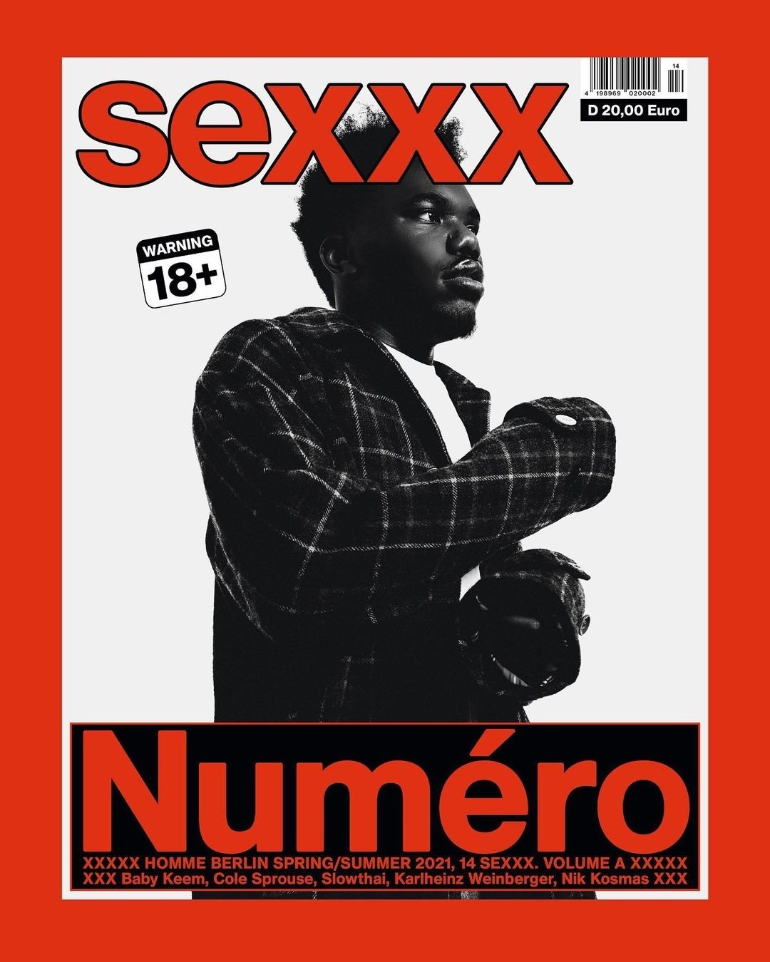 Magazine cover featuring a dark-haired man in a plaid jacket with red and white text and warning labels on a red-bordered background.
