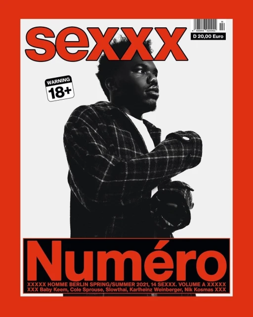 Magazine cover featuring a dark-haired man in a plaid jacket with red and white text and warning labels on a red-bordered background.
