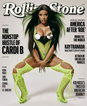 Magazine cover featuring Cardi B in a futuristic, neon-green outfit, posing with spread legs and long nails. The Rolling Stone logo is visible.