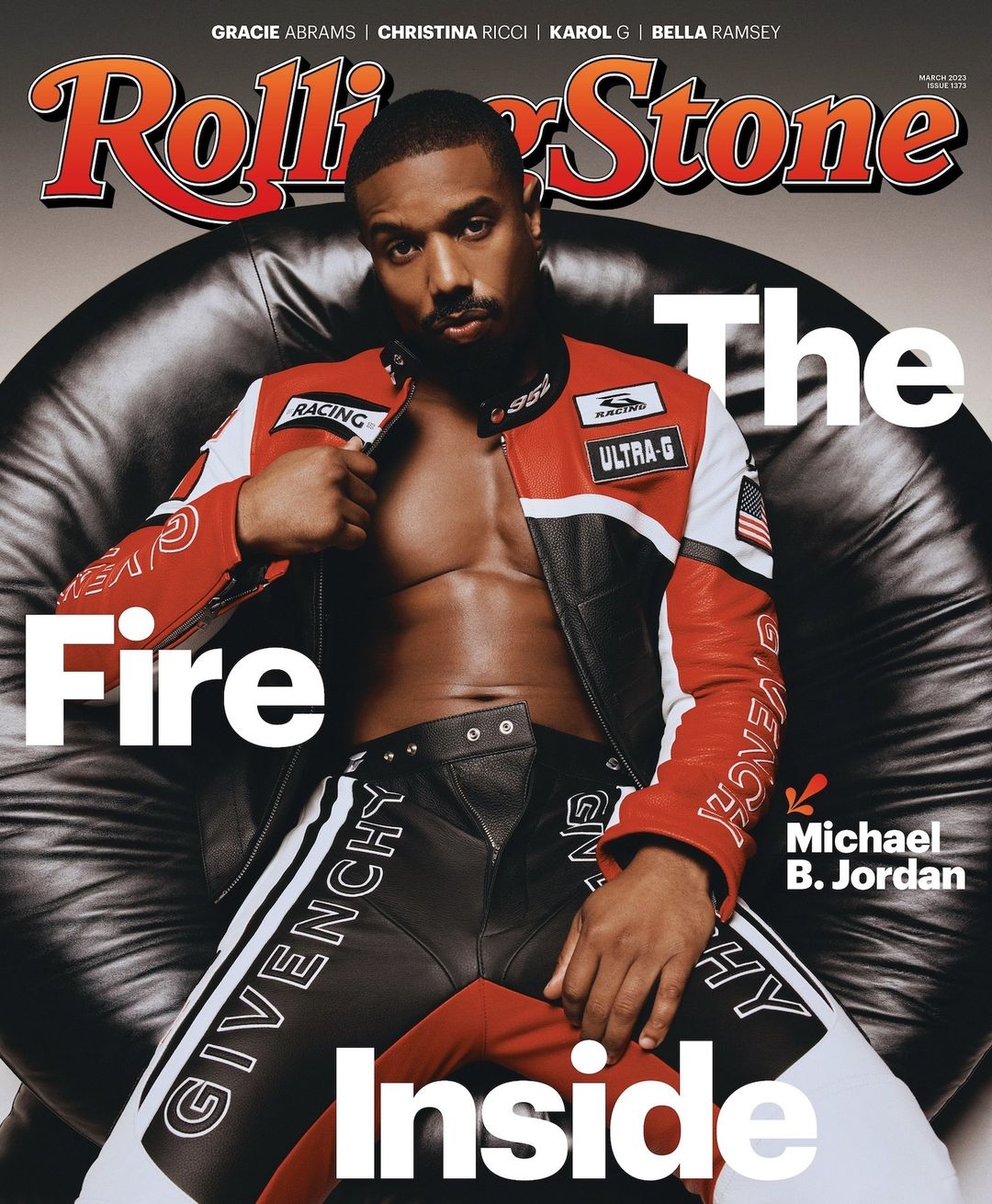 Michael B. Jordan on Rolling Stone cover: Seated with open moto jacket, Givenchy pants, magazine masthead, cover lines, black background. 