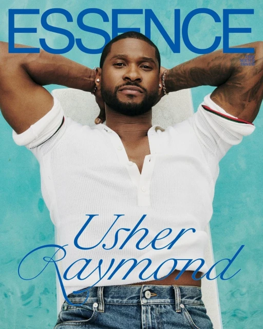 Usher Raymond poses on a blue-toned magazine cover wearing a white waffle-knit shirt and jeans, looking directly at the camera.