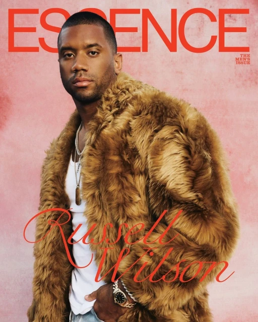 Essence magazine cover featuring Russell Wilson, an adult male wearing a fur coat, jeans, and jewelry, set against a textured background.