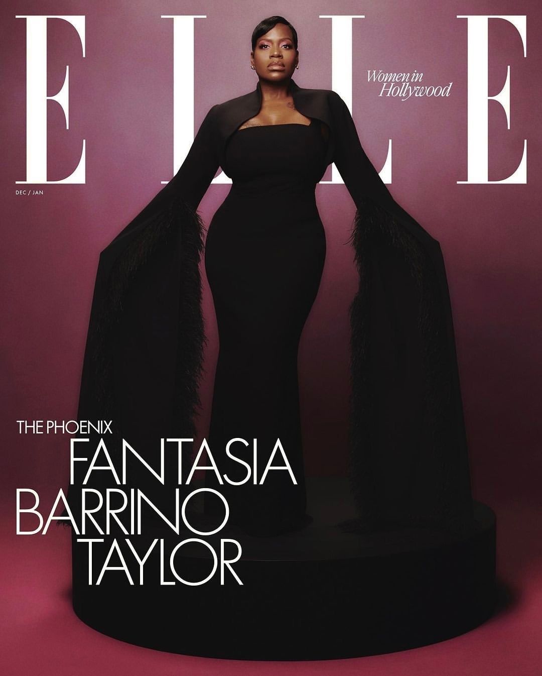 Fantasia Barrino Taylor in black gown on Elle magazine cover, standing on platform in photo studio with pink background.