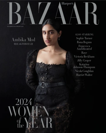 Harper's Bazaar magazine cover featuring Ambika Mod in a lace dress, against a dark background, promoting the 2024 Women of the Year issue.