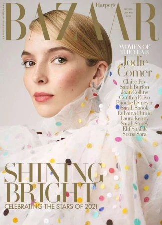 Magazine cover featuring Jodie Comer, 'Women of the Year,' in a polka-dot dress against a neutral background with gold and white accents.