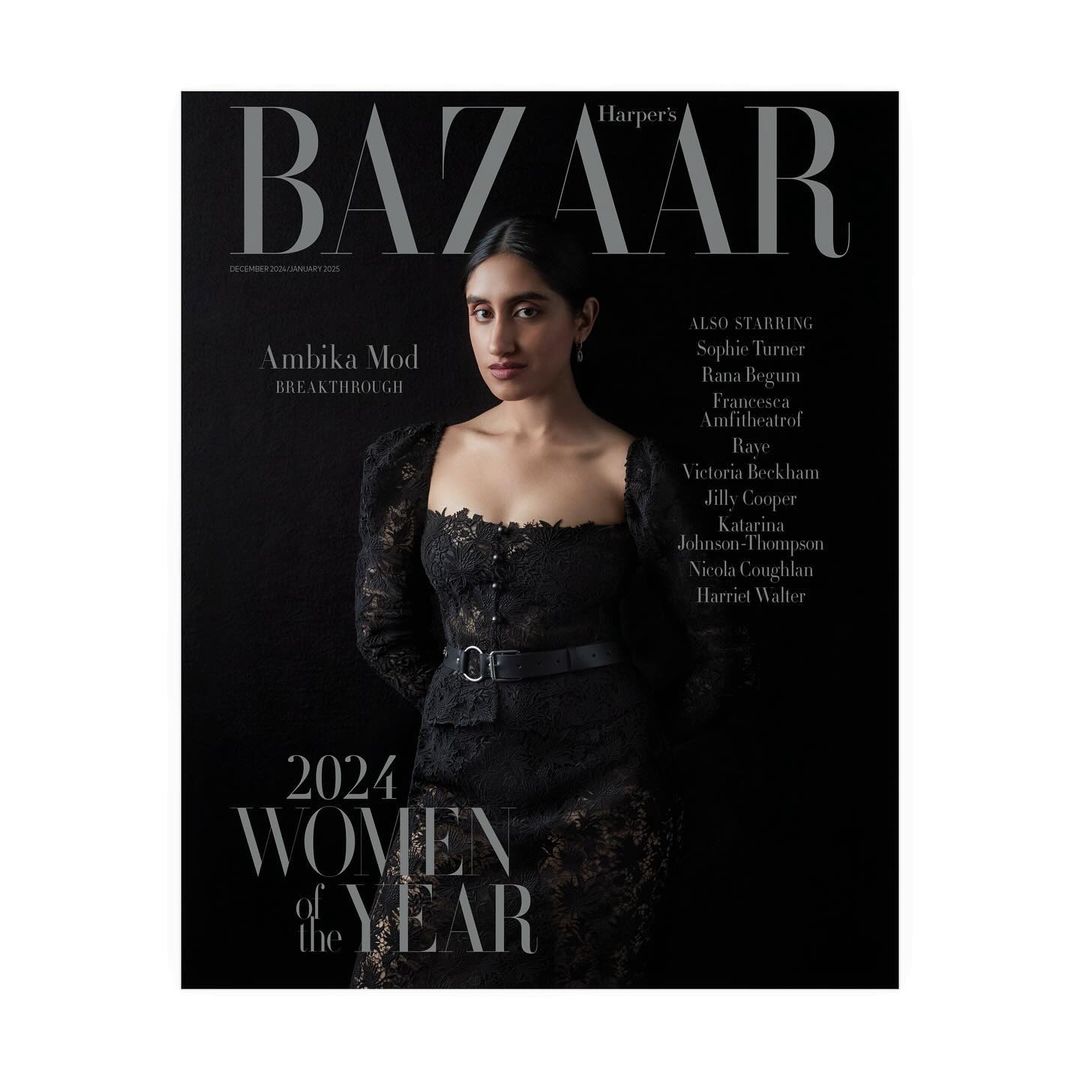 Ambika Mod on Harper's Bazaar cover, December 2024/January 2025 issue. She wears a black lace dress against a dark background.