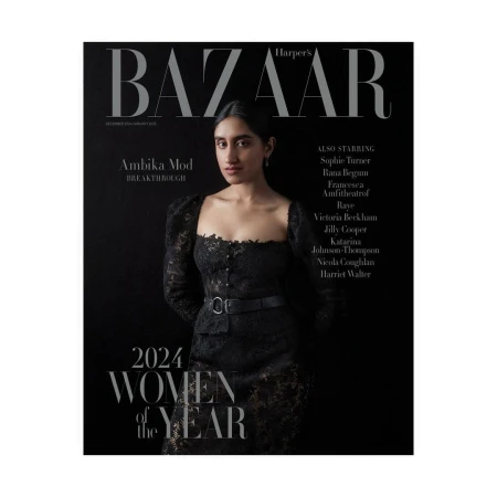Ambika Mod on Harper's Bazaar cover, December 2024/January 2025 issue. She wears a black lace dress against a dark background.