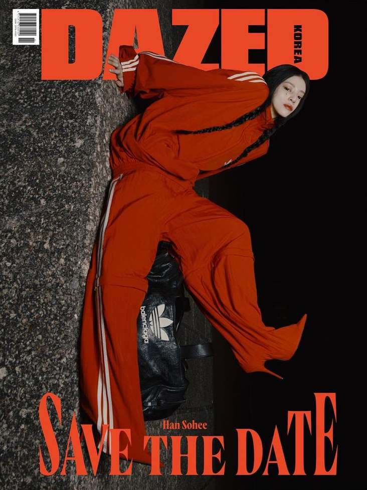 Dazed Korea magazine cover featuring a woman in a red tracksuit posing, with magazine text, against a dark and textured background.