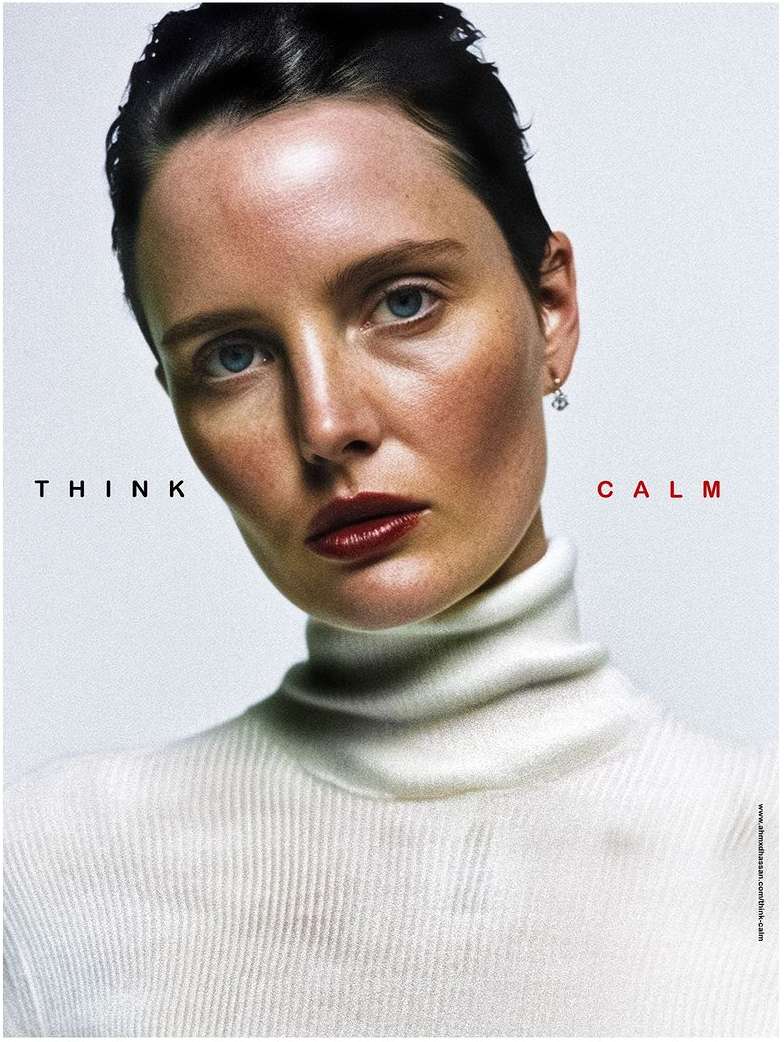 Woman with red lipstick and white turtleneck against a pale backdrop with red 'THINK' and 'CALM' text in a beauty or fashion context.