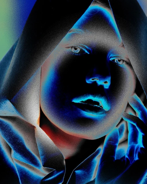 Striking portrait of a woman in a hooded fabric, bathed in neon blue and green light with a surreal, high-contrast, and futuristic aesthetic.