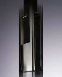Close-up product shot of a tall rectangular glass perfume bottle against a neutral gradient background