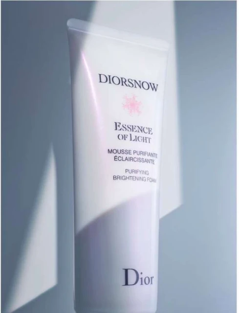DiorSnow Essence of Light Mousse Purifiante Eclaircissante purifying brightening foam in a white container with white background.