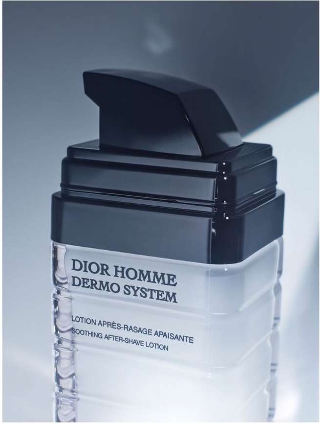 Dior Homme Dermo System after-shave lotion in a clear bottle with black pump. Beauty product with a minimalist design.