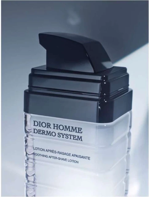 Dior Homme Dermo System after-shave lotion in a clear bottle with black pump. Beauty product with a minimalist design.