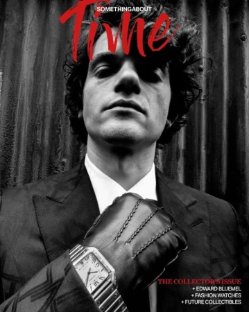 Portrait of a man in a black suit with leather gloves and a watch by photographer Alan Schaller